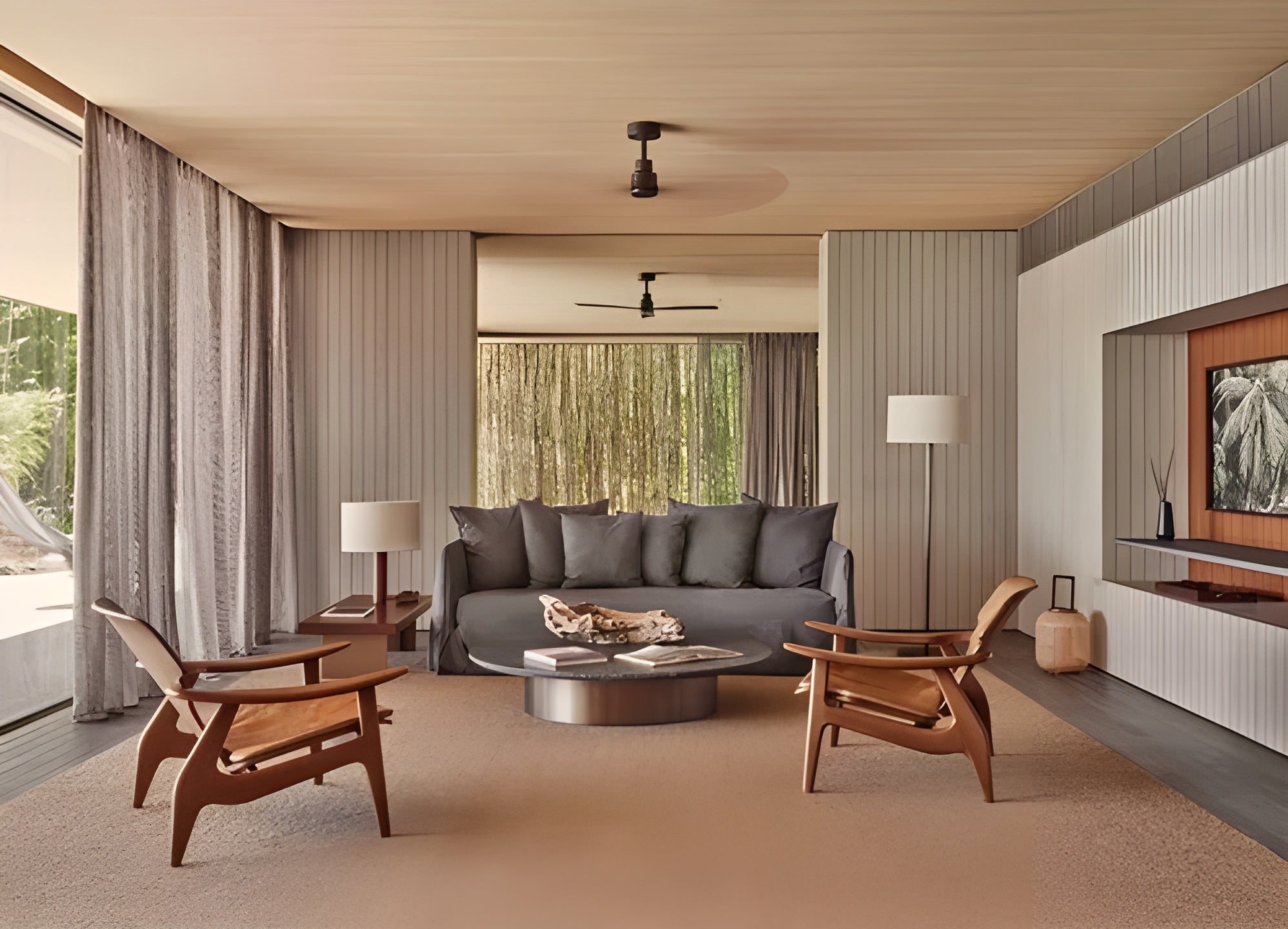 Bright modern living room opening toward a pool and ocean view with Gervasoni Ghost sofa