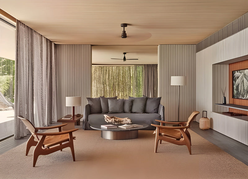 Bright modern living room opening toward a pool and ocean view with Gervasoni Ghost sofa
