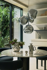 Tom Dixon Melt Mini Chandelier in silver in an official interior setting