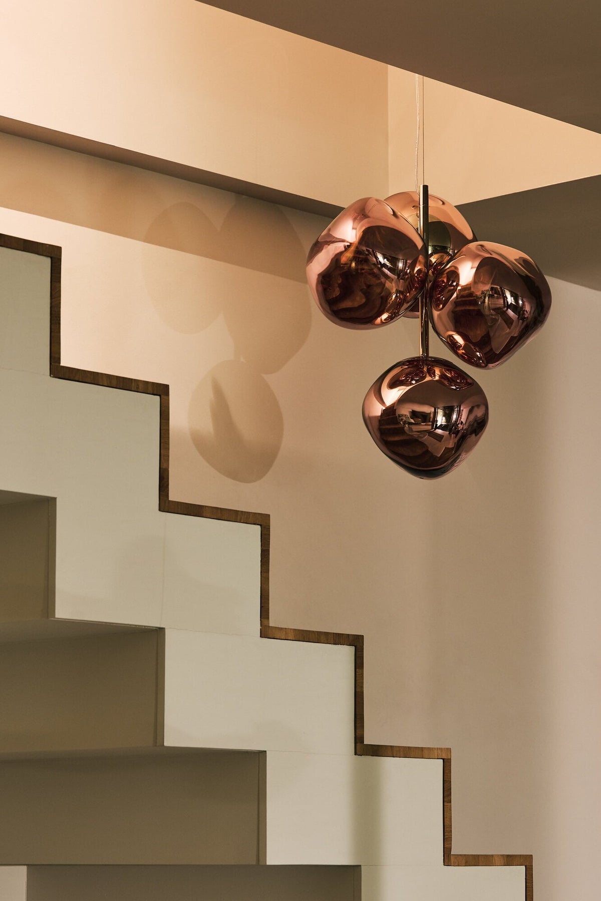 Tom Dixon Melt Mini Chandelier in copper in an official room setting
