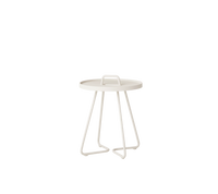 On-the-move mini side table by Cane-line