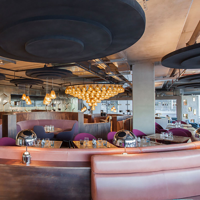 Tom Dixon Bell Table Light in the Eclectic restaurant interior