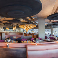 Tom Dixon Bell Table Light in the Eclectic restaurant interior