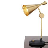 Tom Dixon Beat Table Light in polished brass, angled view