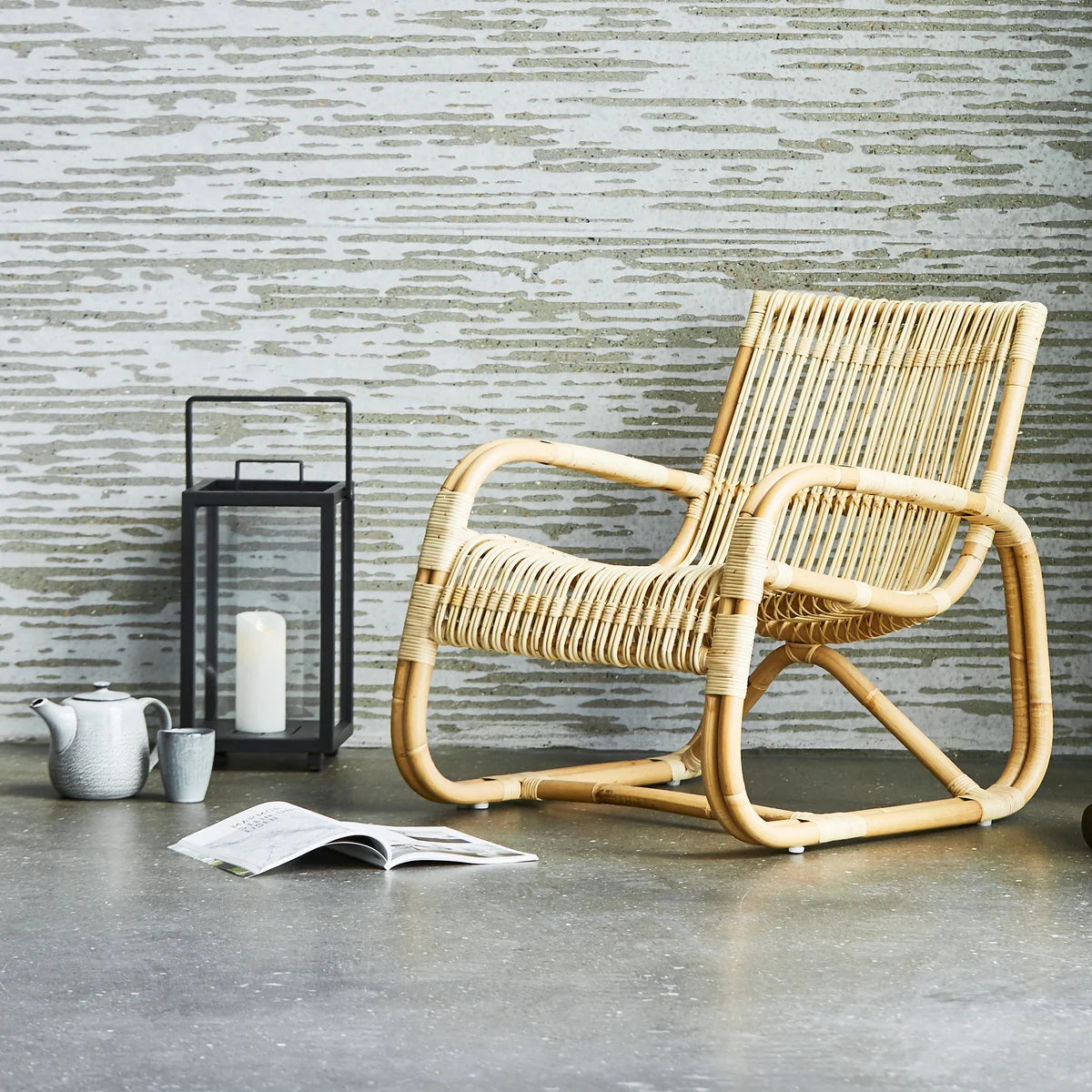 Curve lounge chair indoor lifestyle image by Cane-line