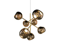 Tom Dixon Melt Large Chandelier in bronze, illuminated on a white background