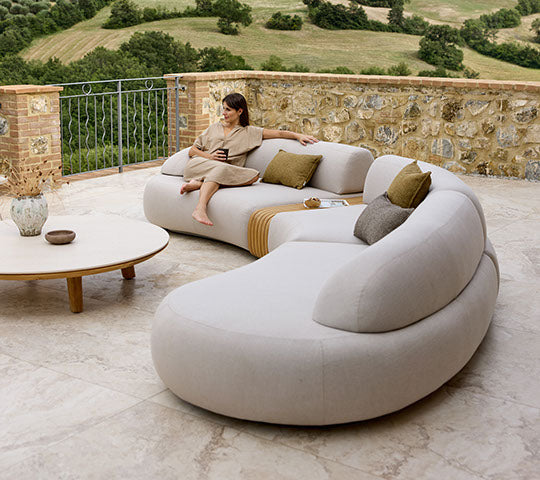 Aspect Coffee Table dia 144cm styled with Mellow sofa outdoor lounge by Cane-line