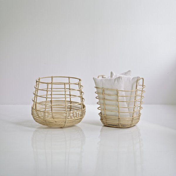 Sweep rattan baskets in an indoor setting by Cane-line