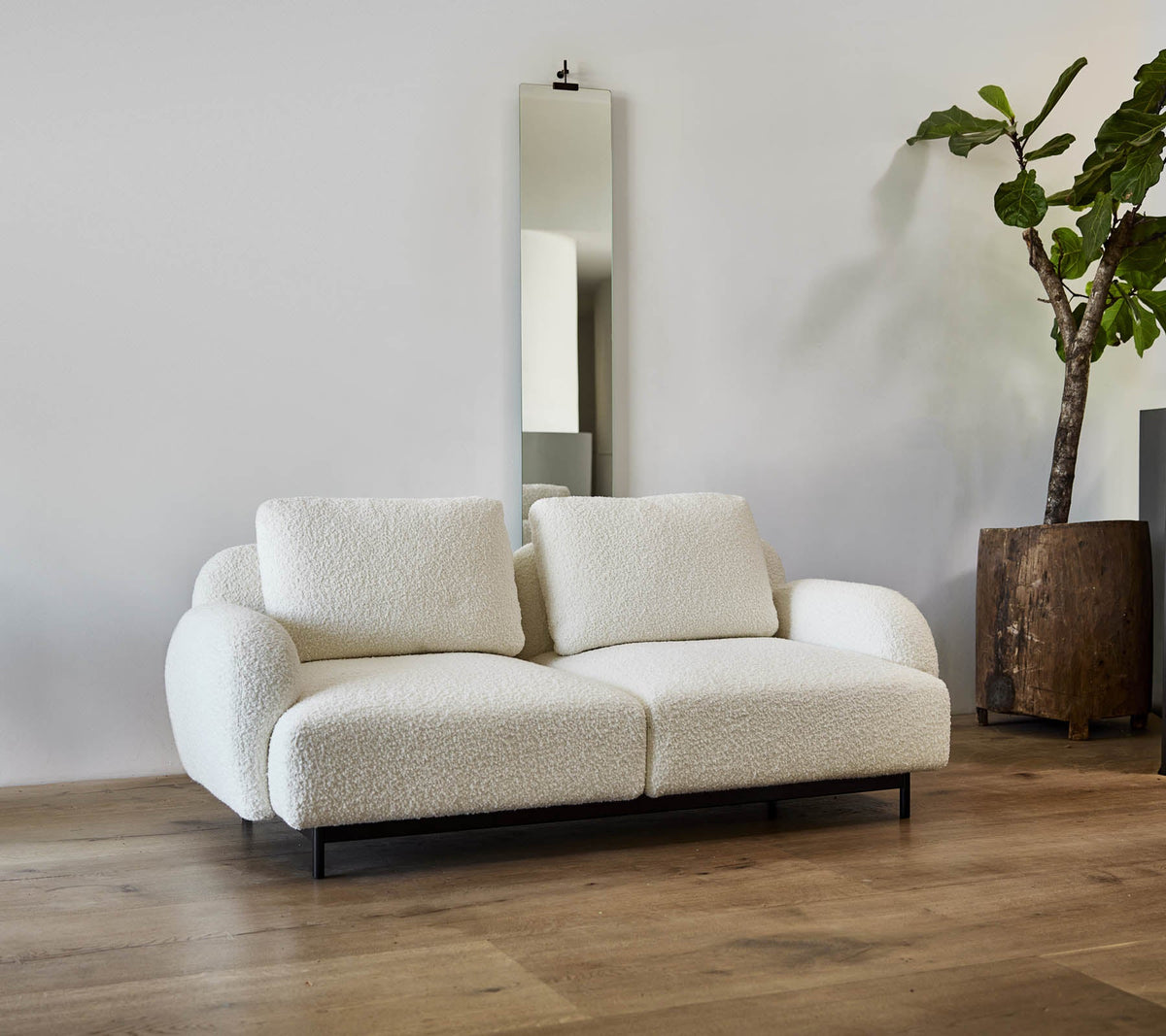 Aura 2-seater sofa lifestyle image by Cane-line, designed by Foersom & Hiort-Lorenzen MDD
