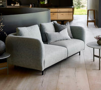 Aura 2-seater sofa lifestyle image by Cane-line, designed by Foersom & Hiort-Lorenzen MDD