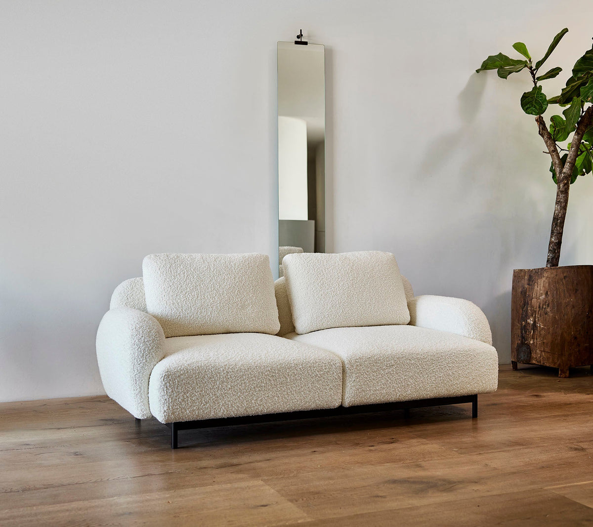 Aura 2-seater sofa lifestyle image by Cane-line, designed by Foersom & Hiort-Lorenzen MDD