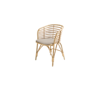 Blend armchair with light brown cushion by Cane-line, designed by Foersom & Hiort-Lorenzen MDD