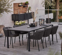 Cane-line Moments chair with outdoor dining table lifestyle image