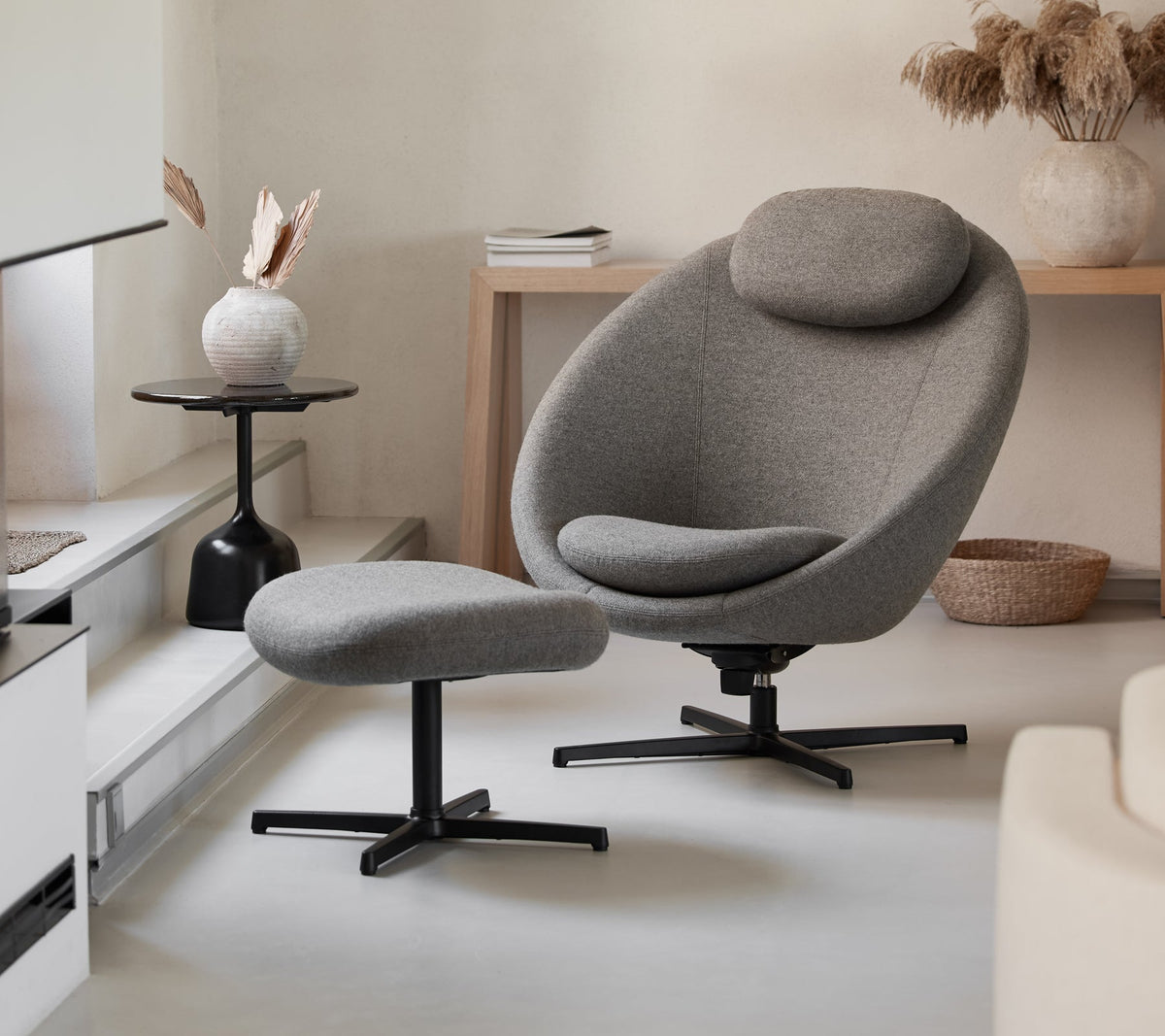 Pace lounge chair with footstool lifestyle image by Cane-line