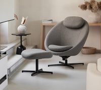 Pace lounge chair with footstool lifestyle image by Cane-line
