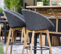 Peacock bar chair lifestyle by Cane-line