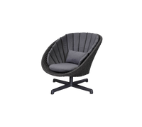 Peacock lounge chair with swivel aluminium base by Cane-line