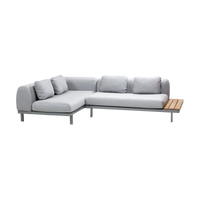 Space compact 2-module corner sofa with side table outdoor sectional sofa by Cane-line, designed by Foersom & Hiort-Lorenzen MDD