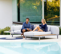 Space modular sofa with chaise longue and side table outdoor sectional sofa by Cane-line, designed by Foersom & Hiort-Lorenzen MDD