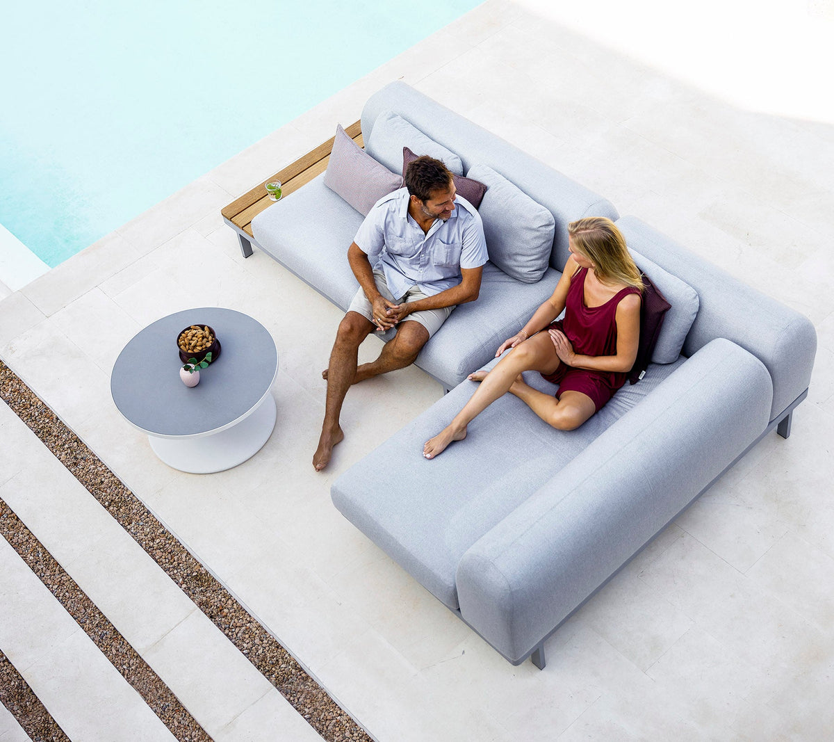 Space compact 2-module corner sofa with side table outdoor sectional sofa by Cane-line, designed by Foersom & Hiort-Lorenzen MDD