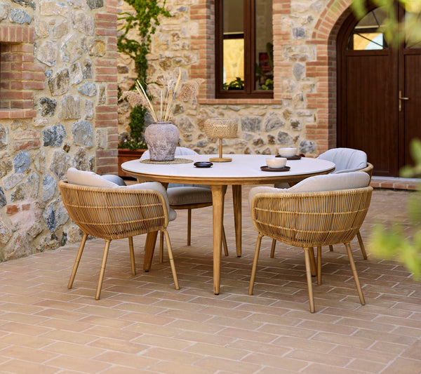 Stay outdoor dining chair lifestyle image with Aspect dining table by Cane-line