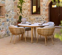 Stay outdoor dining chair lifestyle image with Aspect dining table by Cane-line