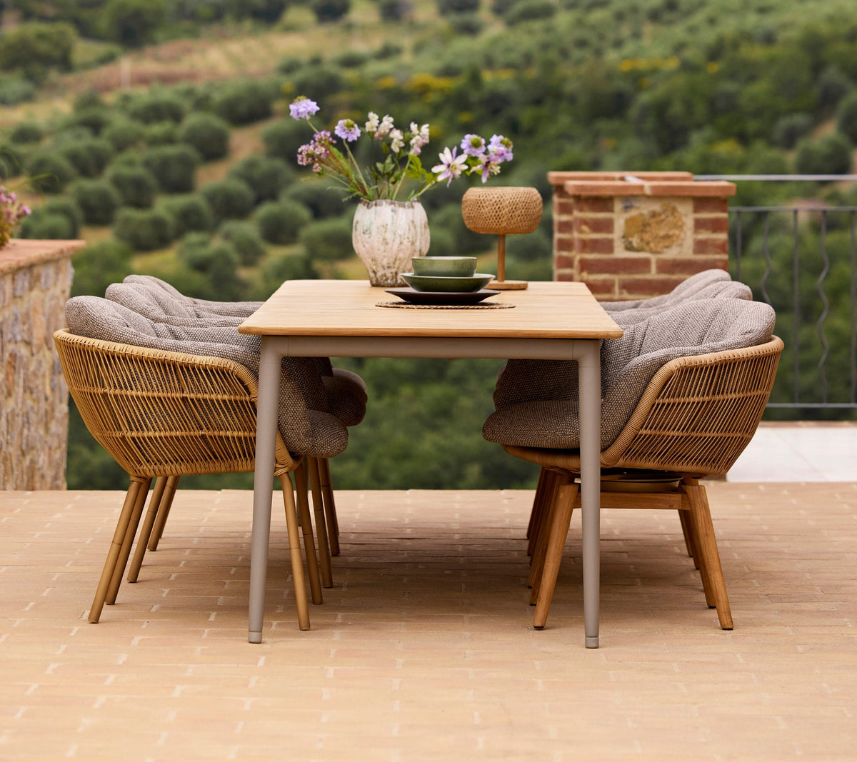 Stay outdoor dining chair lifestyle image with Core dining table by Cane-line