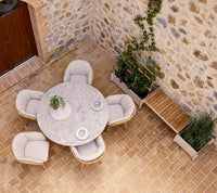 Stay outdoor dining chair lifestyle image with Sticks planter and Aspect dining table by Cane-line