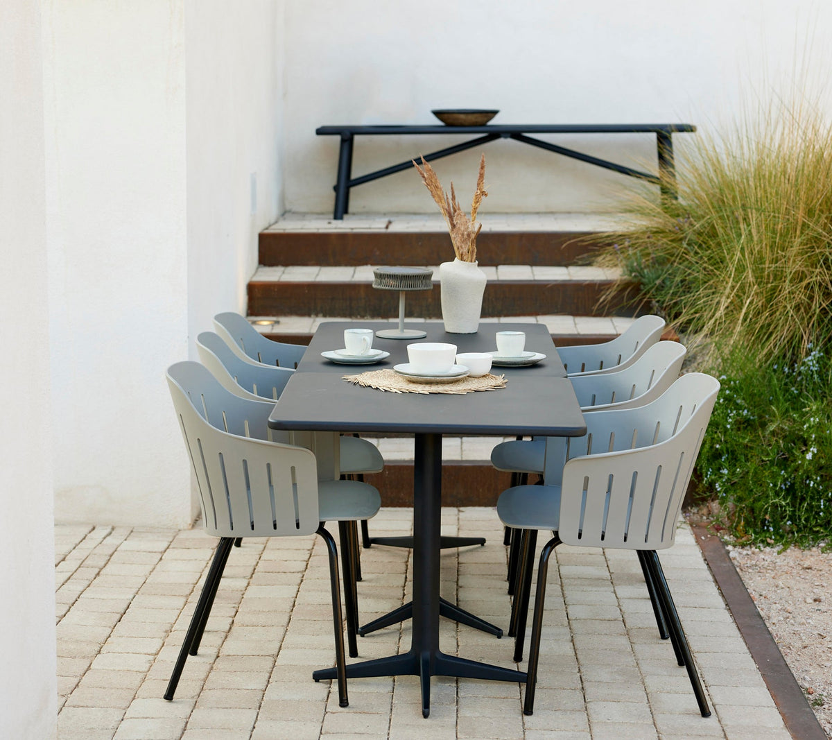 Sticks aluminium bench in an outdoor dining setting