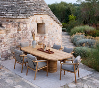 Sticks armchair cushion set shown in an outdoor dining setting by Cane-line