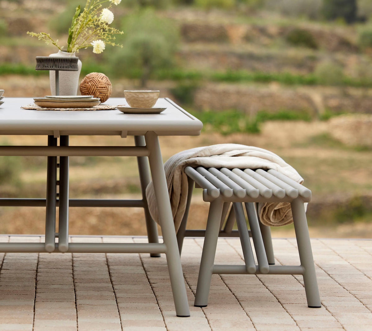 Sticks bench cushion in an outdoor dining setting
