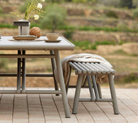 Sticks bench cushion in an outdoor dining setting