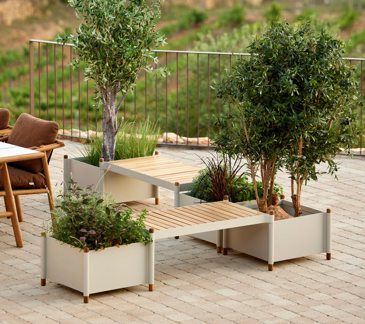 Sticks bench including two planters in sand