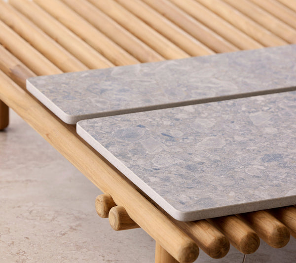 Sticks ceramic tabletops in an outdoor setting