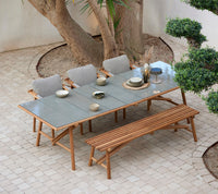 Sticks dining table with bench and armchair lifestyle image by Cane-line
