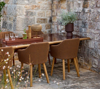 Sticks dining table lifestyle image with Choice chair and Club tray by Cane-line