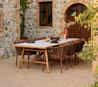 Sticks dining table lifestyle image with Ocean dining chair by Cane-line