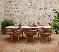 Sticks dining table lifestyle image with Stay dining chair by Cane-line