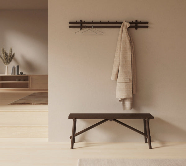 Sticks coat rack 120 cm in an indoor setting