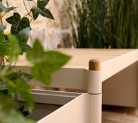 Sticks bench with planters in an outdoor setting