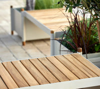 Sticks bench and planters in sand finish
