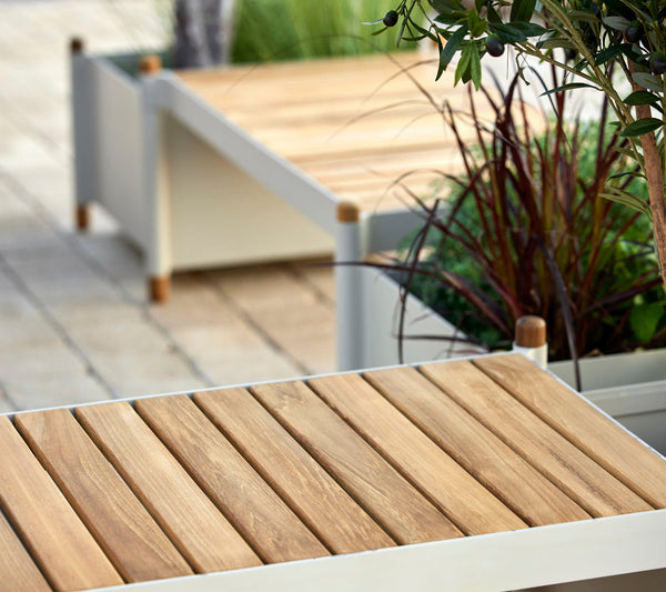 Sticks bench and planters in sand finish