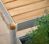 Sticks bench and planters in teak and sand
