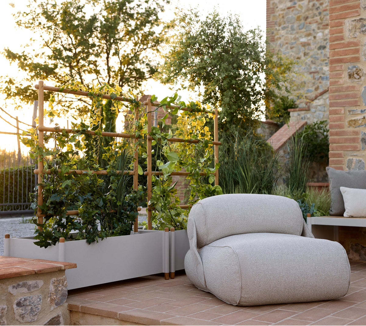 Sticks planter with outdoor lounge seating by Cane-line