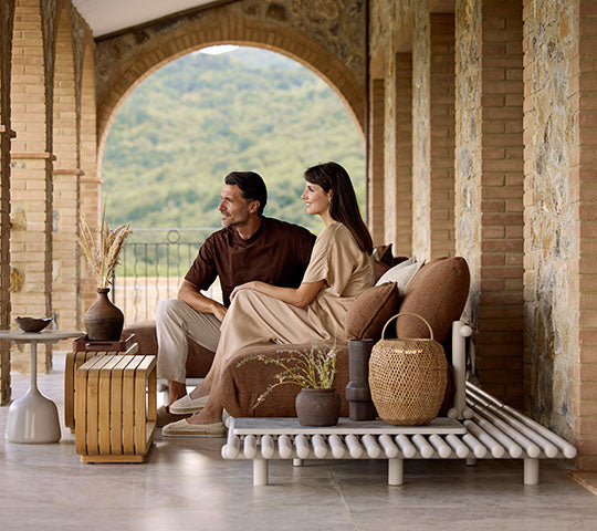Sticks platform aluminium lifestyle image with Mellow coffee table and Illusion lamp by Cane-line