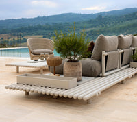 Sticks platform aluminium lifestyle image with Club storage box and Coast lounge chair by Cane-line