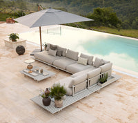 Sticks platform aluminium lounge lifestyle image with Sticks coffee table by Cane-line