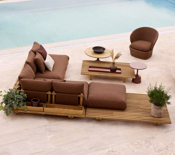 Sticks platform large corner sofa teak lifestyle image with Coast lounge chair by Cane-line