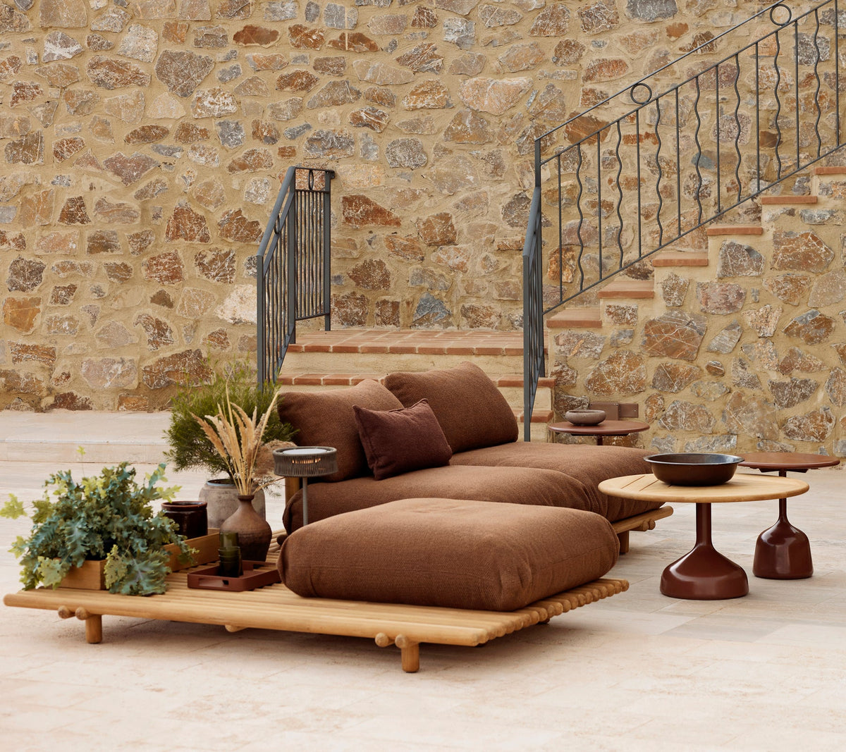 Sticks platform teak lounge lifestyle image with Glaze coffee table by Cane-line