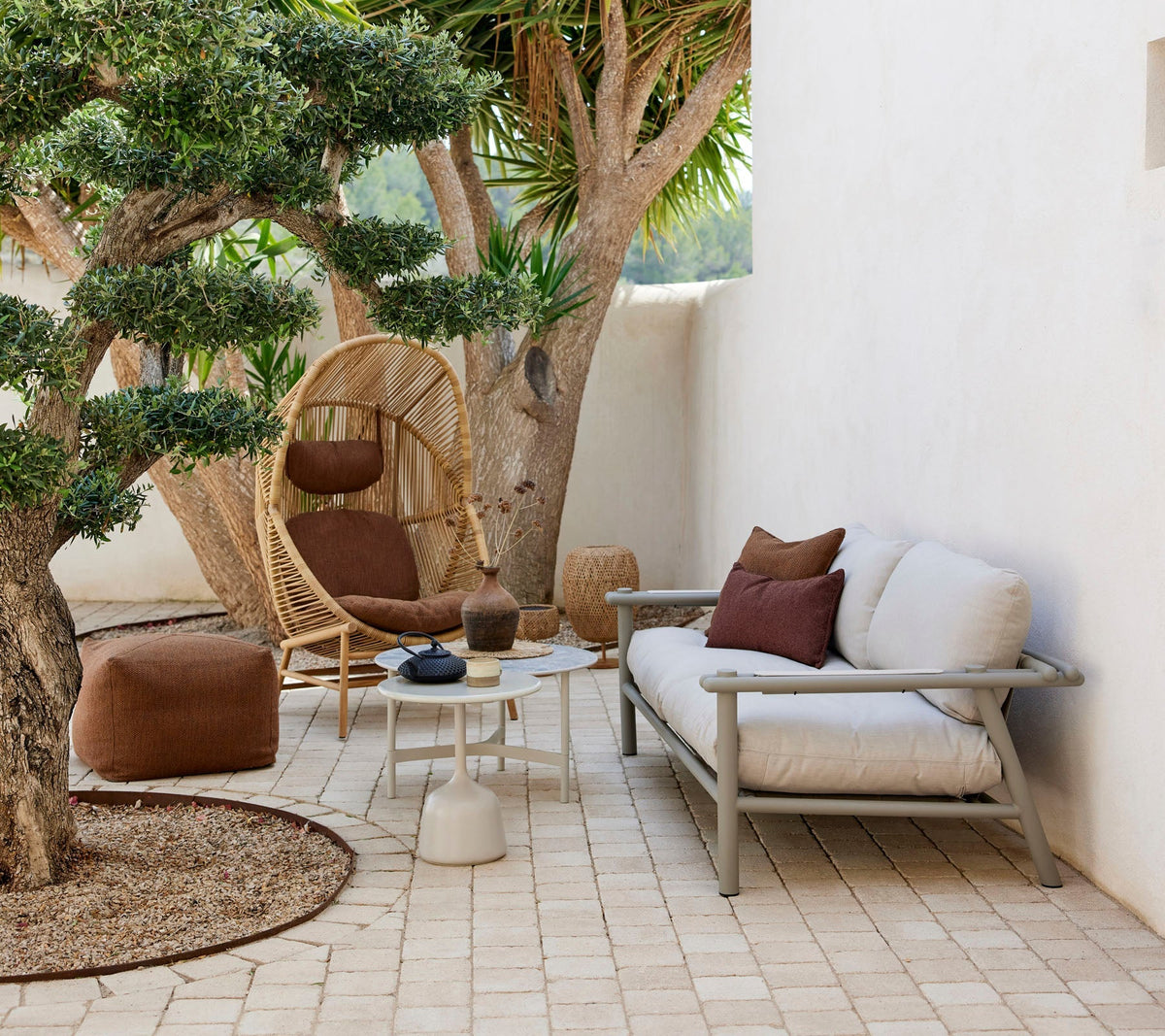 Sticks sofa in a complete outdoor lounge setting